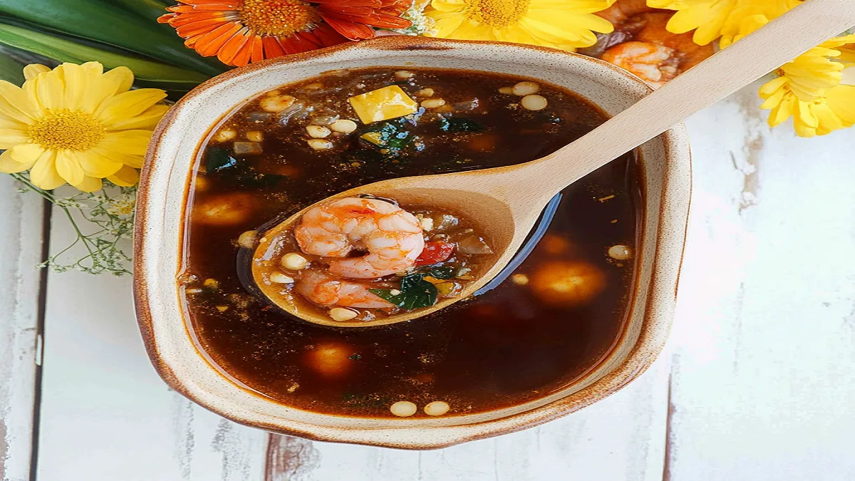 Seafood boil sauce poured over shrimp and crab